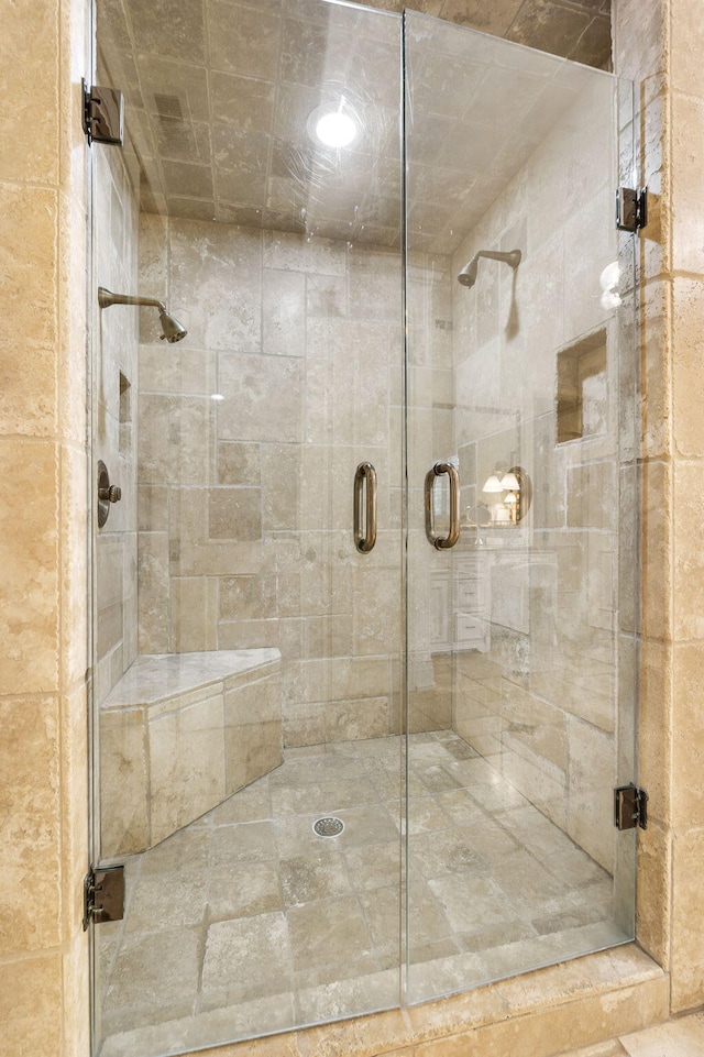 bathroom with a shower stall