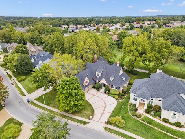 birds eye view of property with a residential view