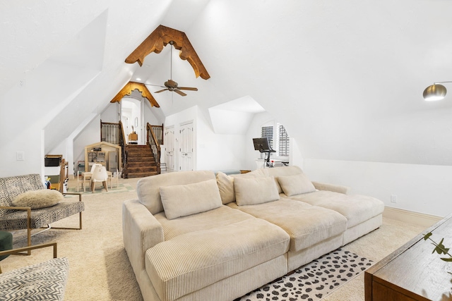 living room with stairway, lofted ceiling, a ceiling fan, and carpet