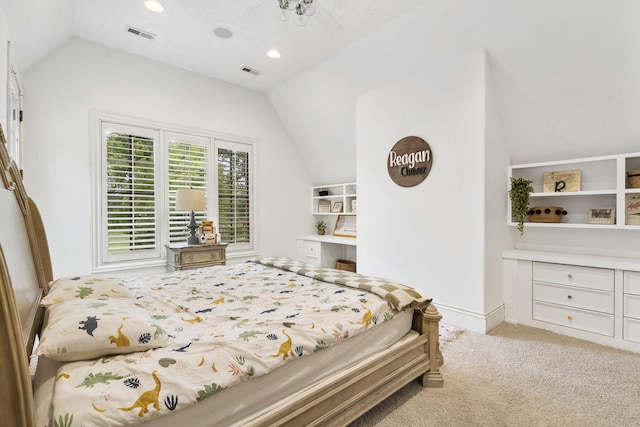 carpeted bedroom featuring lofted ceiling