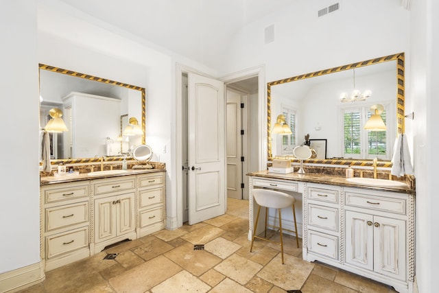 bathroom featuring a notable chandelier and vanity