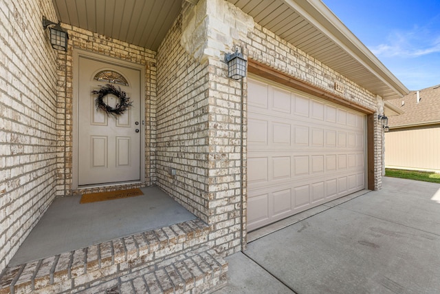 doorway to property with a garage