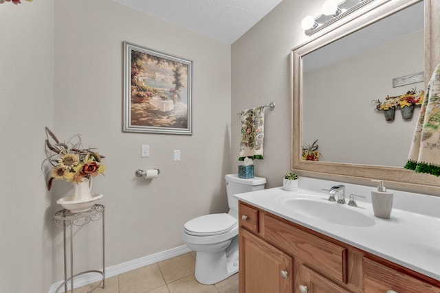 bathroom with vanity, tile patterned flooring, toilet, and a textured ceiling