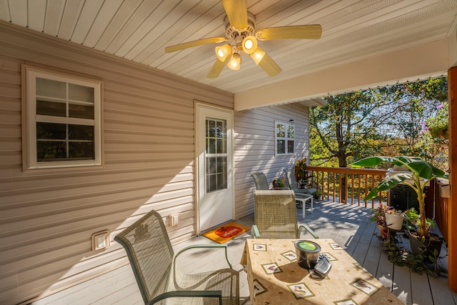 wooden deck featuring ceiling fan