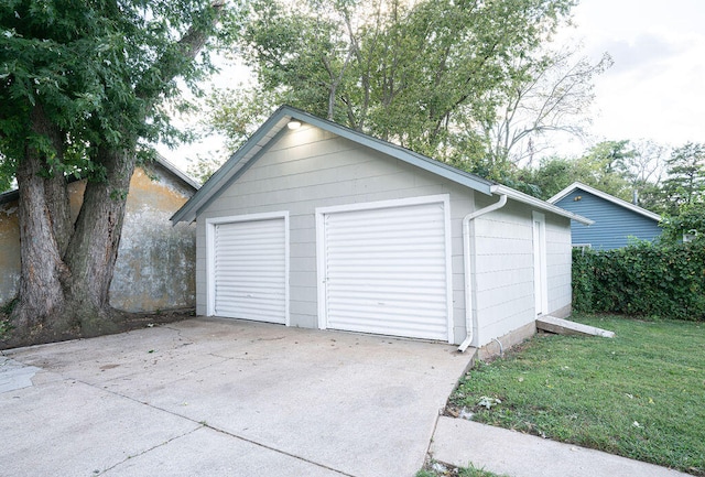 garage featuring a yard