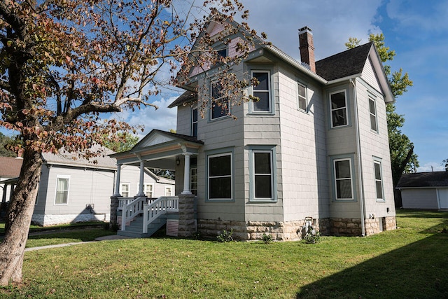 view of side of property with a lawn