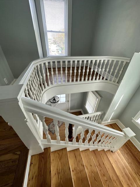 stairway featuring hardwood / wood-style flooring