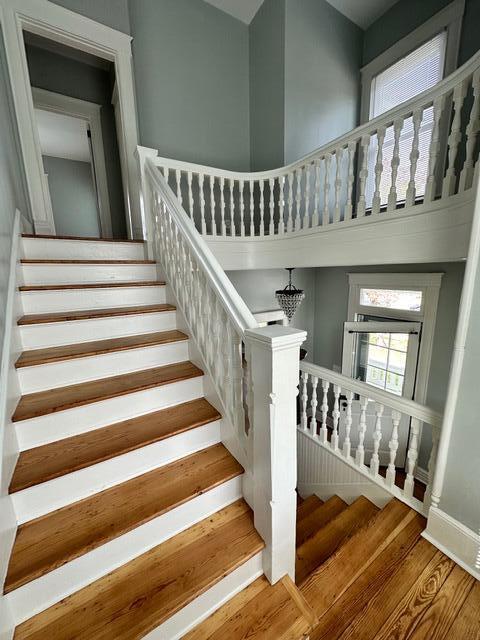 stairs with hardwood / wood-style flooring