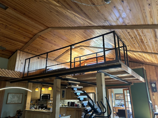 interior space with wooden ceiling and stainless steel appliances