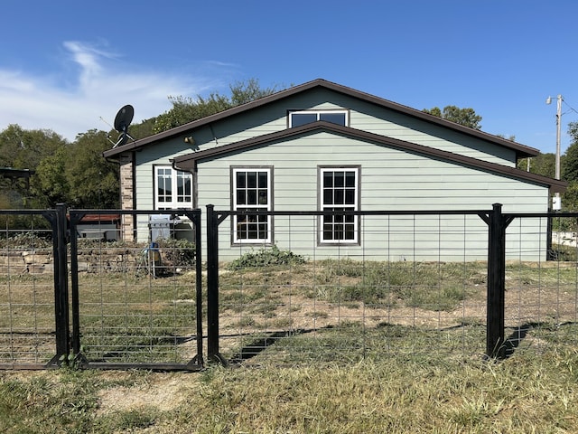 view of side of property with fence