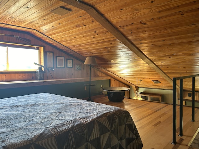 bedroom with wood finished floors, wood walls, wooden ceiling, and lofted ceiling