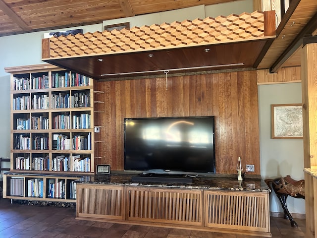 living room featuring wood walls and wood ceiling