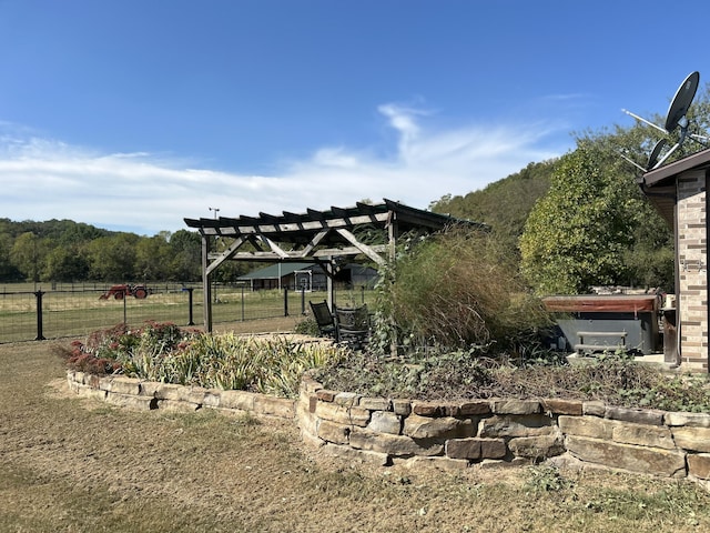 view of yard featuring a pergola and fence