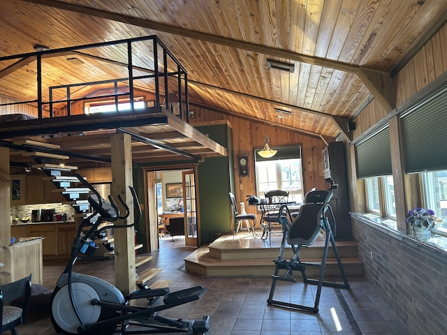 workout room featuring wooden walls, wooden ceiling, and vaulted ceiling