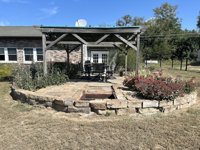 view of patio / terrace featuring french doors and fence
