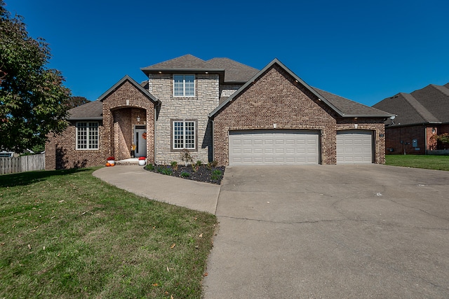 view of front facade featuring a front lawn and a garage