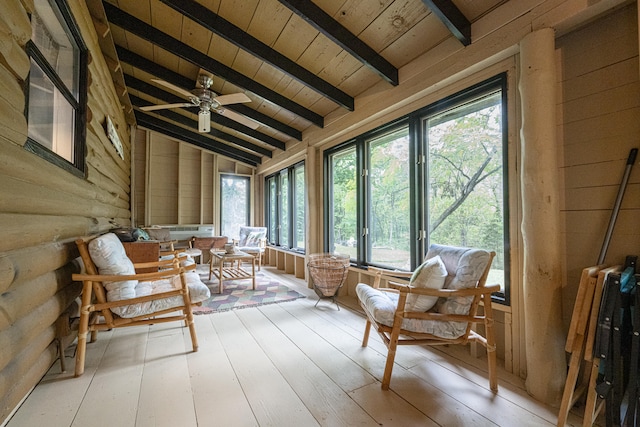 unfurnished sunroom featuring wood ceiling, vaulted ceiling with beams, and ceiling fan