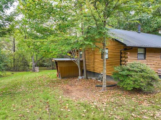 view of property exterior with a lawn