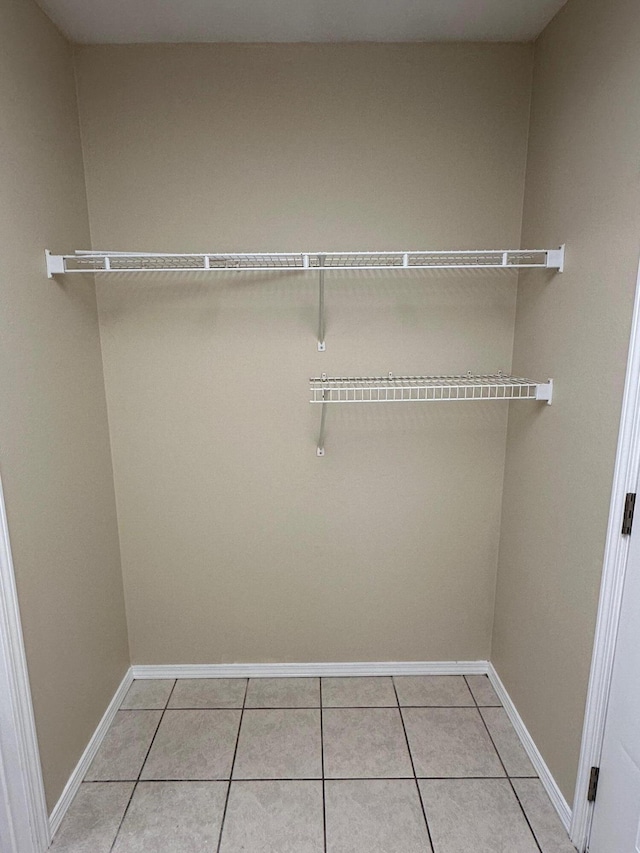 walk in closet featuring light tile patterned floors