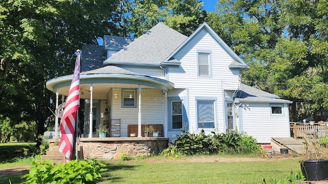 view of front of home featuring a front lawn and covered porch