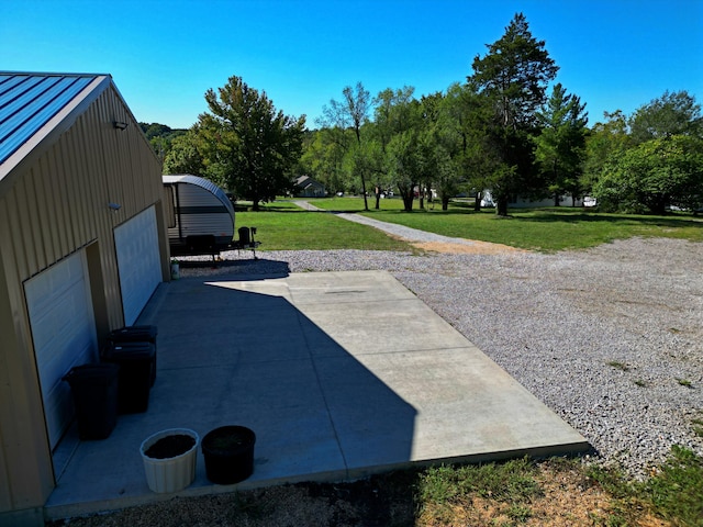 view of patio featuring a garage