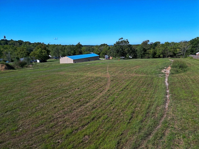 view of yard with a rural view