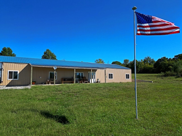 back of property with a yard