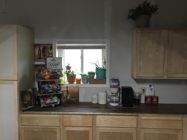 bar with light brown cabinets