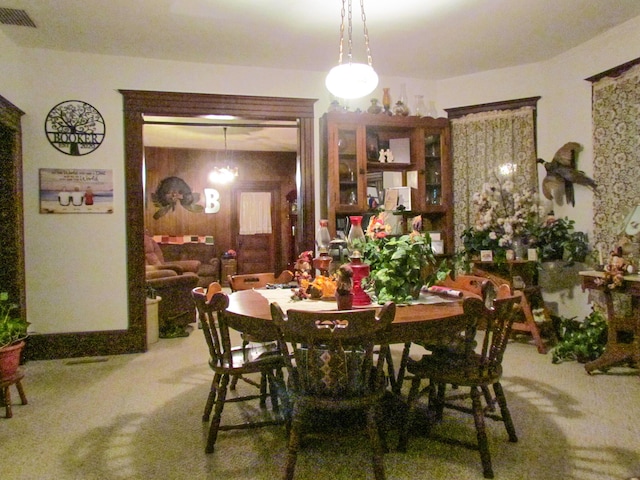 dining area with carpet floors and visible vents