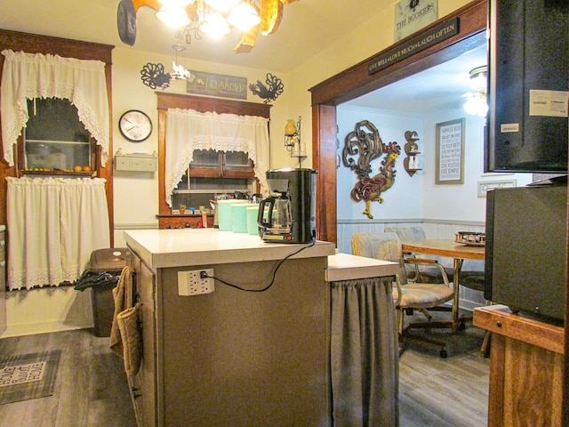 interior space with wood finished floors and a notable chandelier