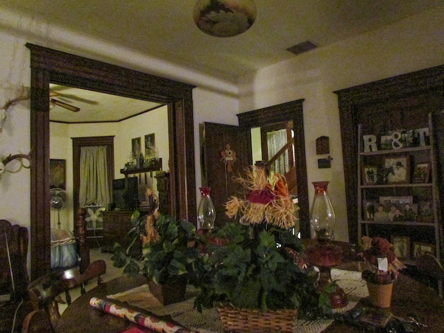 interior space featuring ceiling fan and visible vents
