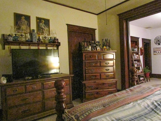 bedroom featuring crown molding