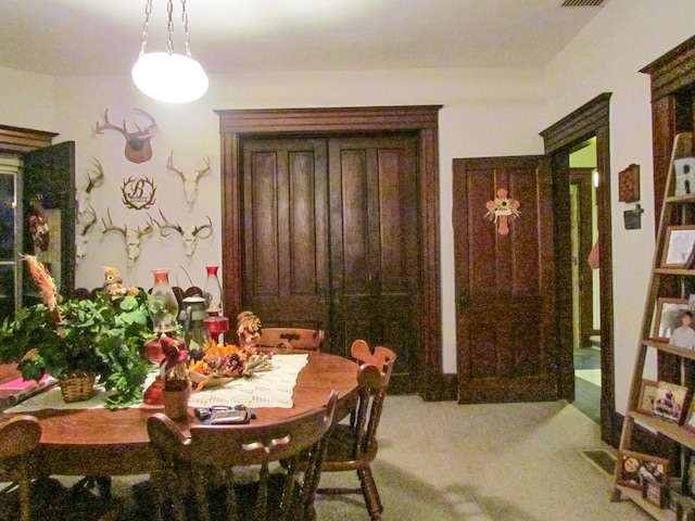 view of carpeted dining space