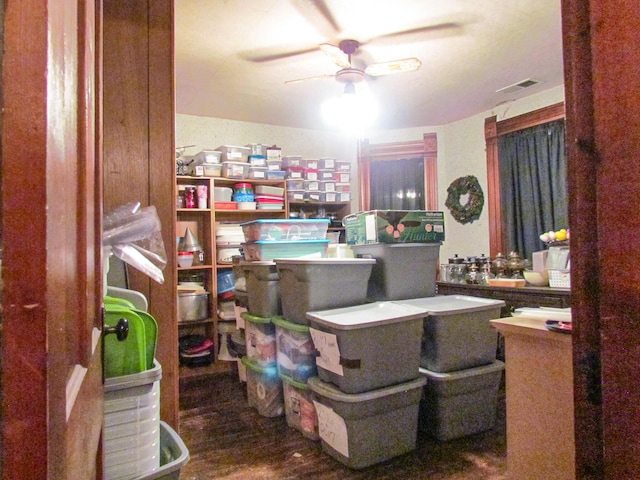 interior space with ceiling fan and visible vents