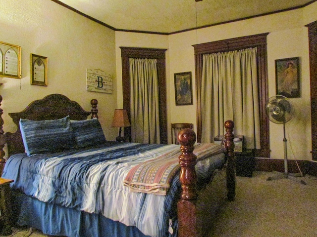 carpeted bedroom featuring crown molding