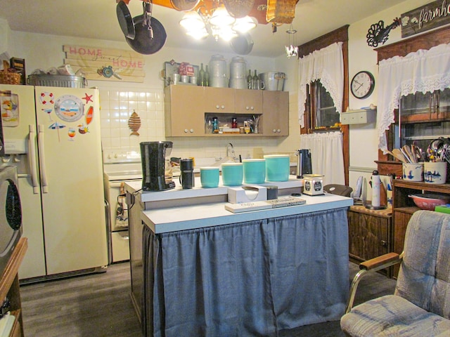 kitchen featuring backsplash, light countertops, dark wood-type flooring, a center island, and white refrigerator with ice dispenser