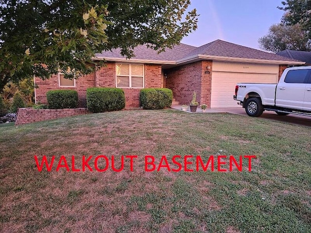 ranch-style house with a front lawn and a garage