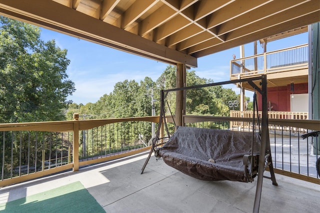 view of patio with a balcony