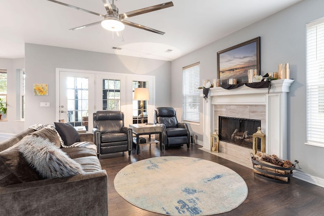 living room featuring dark hardwood / wood-style flooring and a healthy amount of sunlight