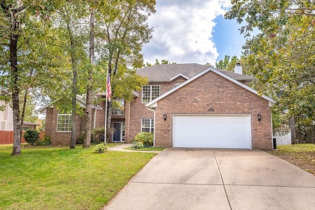 view of front of home featuring a front lawn and a garage