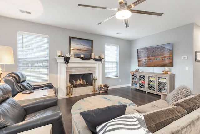 living room with ceiling fan and dark hardwood / wood-style flooring