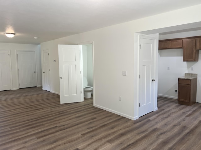 4073 White Oak Lot 4, Merriam Woods, MO 65740 - unfurnished living room featuring dark wood finished floors and baseboards