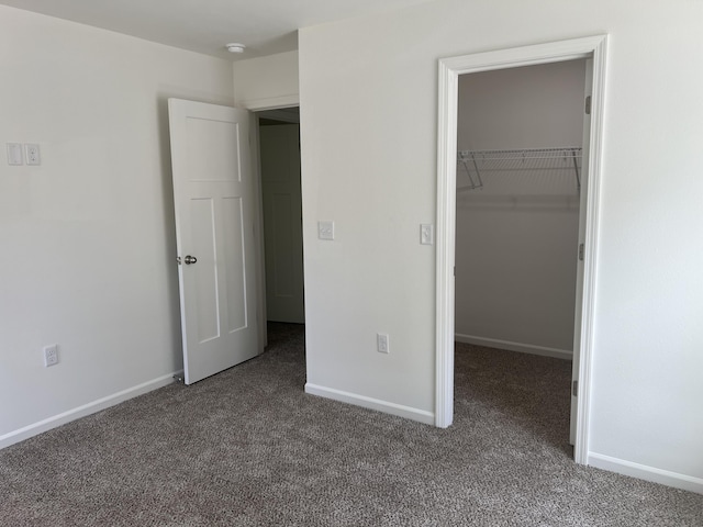 4073 White Oak Lot 4, Merriam Woods, MO 65740 - unfurnished bedroom with carpet flooring and a walk in closet