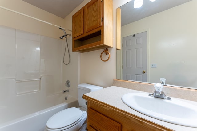 full bathroom with vanity, toilet, and  shower combination