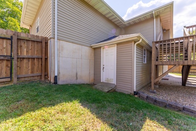 view of outbuilding featuring a lawn