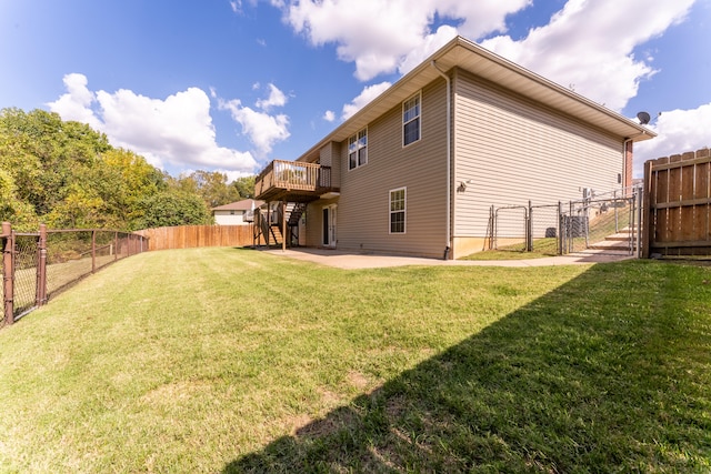 exterior space featuring a wooden deck and a patio