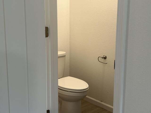 4071 White Oak Rd Lot 5, Merriam Woods, MO 65740 - bathroom with wood finished floors, toilet, and baseboards