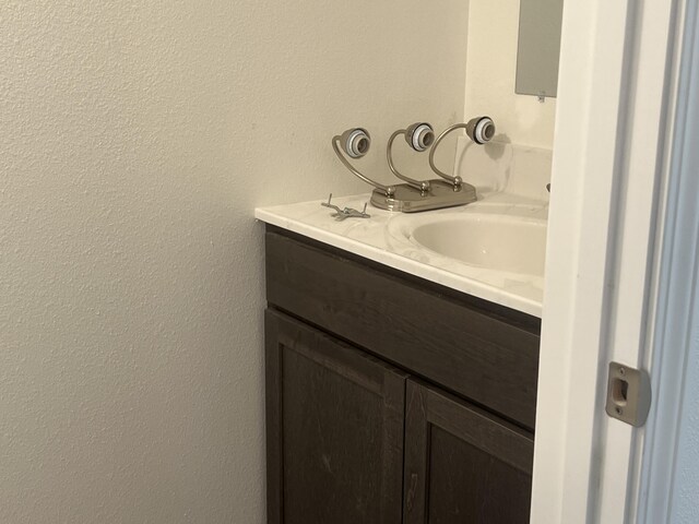 4071 White Oak Rd Lot 5, Merriam Woods, MO 65740 - bathroom featuring vanity and a textured wall