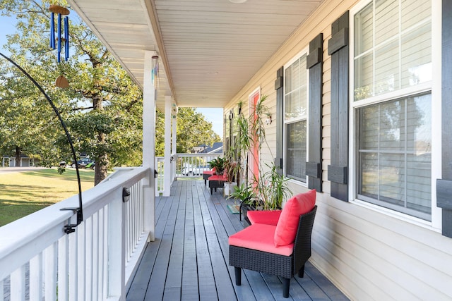 wooden terrace featuring covered porch