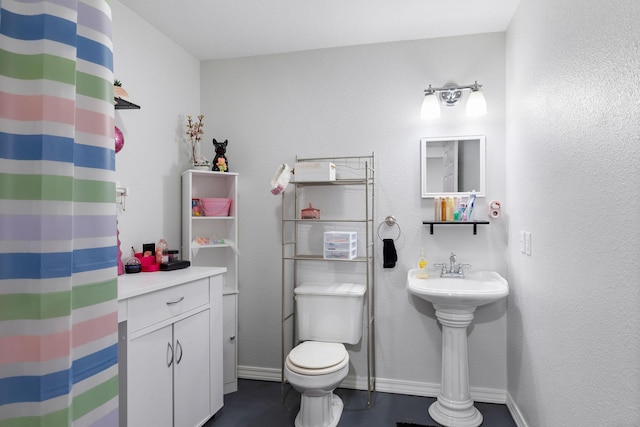 160 Mary Ln, Kirbyville, MO 65679 - bathroom with a shower with shower curtain, toilet, and baseboards